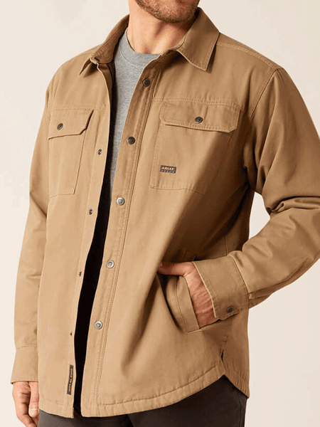 Ariat 10052426 Mens Rebar Canvas Shirt Jacket Khaki side pocket view. If you need any assistance with this item or the purchase of this item please call us at five six one seven four eight eight eight zero one Monday through Saturday 10:00a.m EST to 8:00 p.m EST