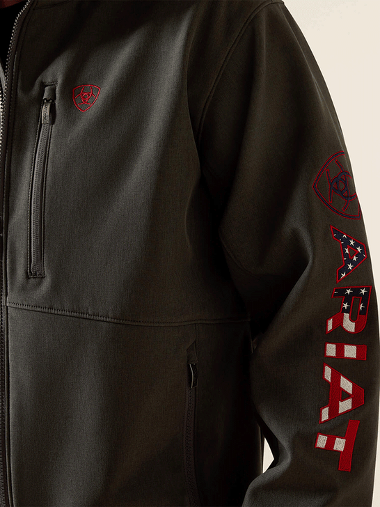 Ariat 10062579 Mens Logo Softshell Jacket Charcoal close up. If you need any assistance with this item or the purchase of this item please call us at five six one seven four eight eight eight zero one Monday through Saturday 10:00a.m EST to 8:00 p.m EST