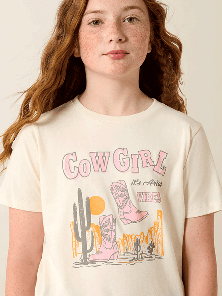Ariat 10071704 Kids Cowgirl Vibes T-Shirt Natural close up. If you need any assistance with this item or the purchase of this item please call us at five six one seven four eight eight eight zero one Monday through Saturday 10:00a.m EST to 8:00 p.m EST