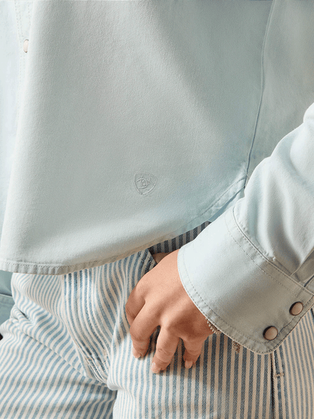 Ariat 10071774 Womens Asheville Snap Shirt Light Blue close up. If you need any assistance with this item or the purchase of this item please call us at five six one seven four eight eight eight zero one Monday through Saturday 10:00a.m EST to 8:00 p.m EST