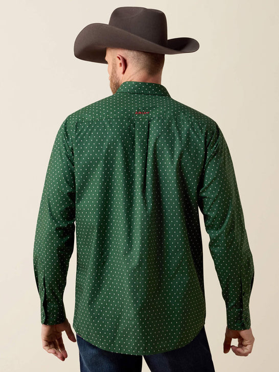 A man viewed from the back wearing a dark green long-sleeve button-up shirt with a small white polka dot pattern, paired with a dark brown cowboy hat and dark jeans, against a solid beige background. If you need any assistance with this item or the purchase of this item please call us at five six one seven four eight eight eight zero one Monday through Saturday 10:00a.m EST to 8:00 p.m EST