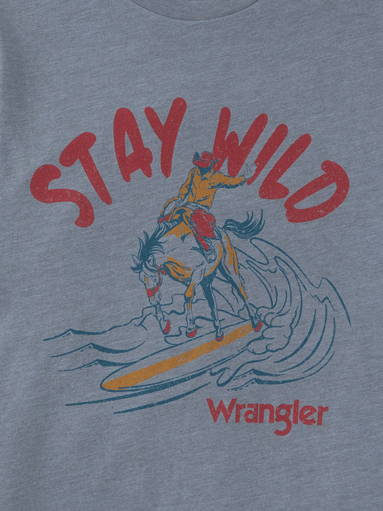 Wrangler 112347240 Kids Stay Wild Surfer Tee Grey close up view of graphic. If you need any assistance with this item or the purchase of this item please call us at five six one seven four eight eight eight zero one Monday through Saturday 10:00a.m EST to 8:00 p.m EST