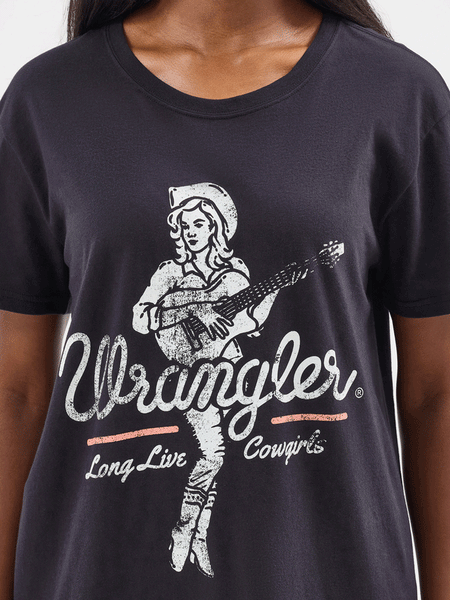 Wrangler 112354395 Womens Long Live Cowgirls Tee Black front graphic close up view. If you need any assistance with this item or the purchase of this item please call us at five six one seven four eight eight eight zero one Monday through Saturday 10:00a.m EST to 8:00 p.m EST
