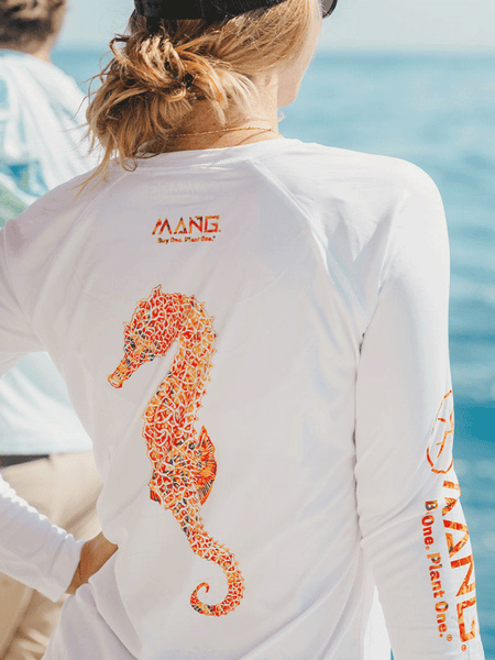MANG WP1263LS Womens Seahorse MANG Long Sleeve Performance Tee White on model. If you need any assistance with this item or the purchase of this item please call us at five six one seven four eight eight eight zero one Monday through Saturday 10:00a.m EST to 8:00 p.m EST