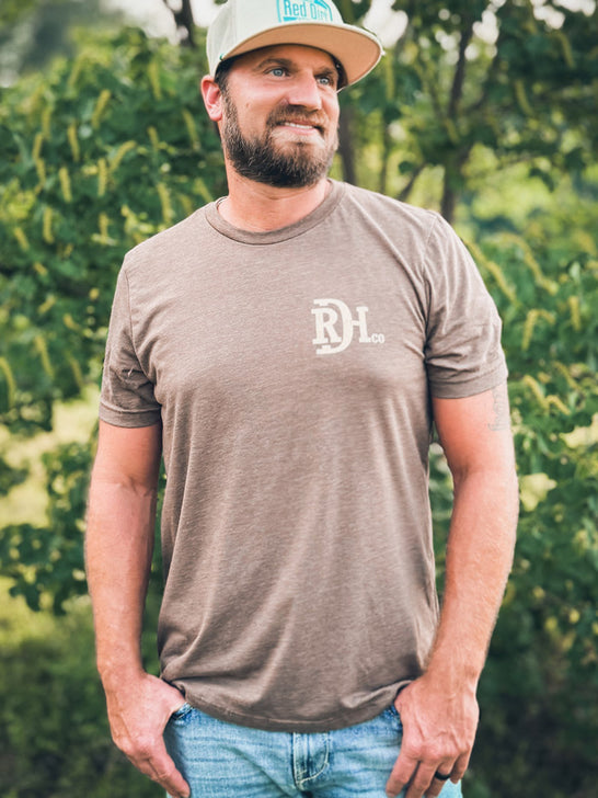 Red Dirt RDHC-T-185 Mens Tooled Leather Tee Black Brown front view. If you need any assistance with this item or the purchase of this item please call us at five six one seven four eight eight eight zero one Monday through Saturday 10:00a.m EST to 8:00 p.m EST