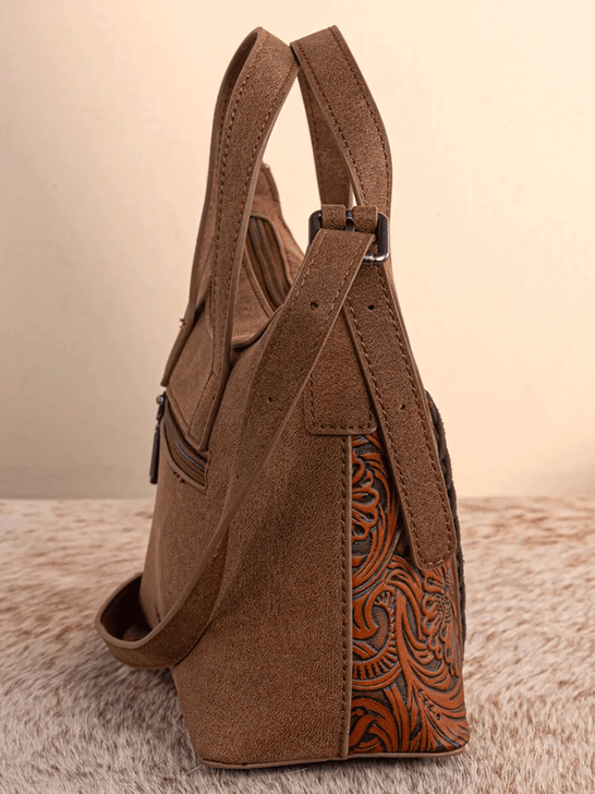 Wrangler WG226-8605BR Womens Tooled Aztec Pattern Print Crossbody Brown side view. If you need any assistance with this item or the purchase of this item please call us at five six one seven four eight eight eight zero one Monday through Saturday 10:00a.m EST to 8:00 p.m EST