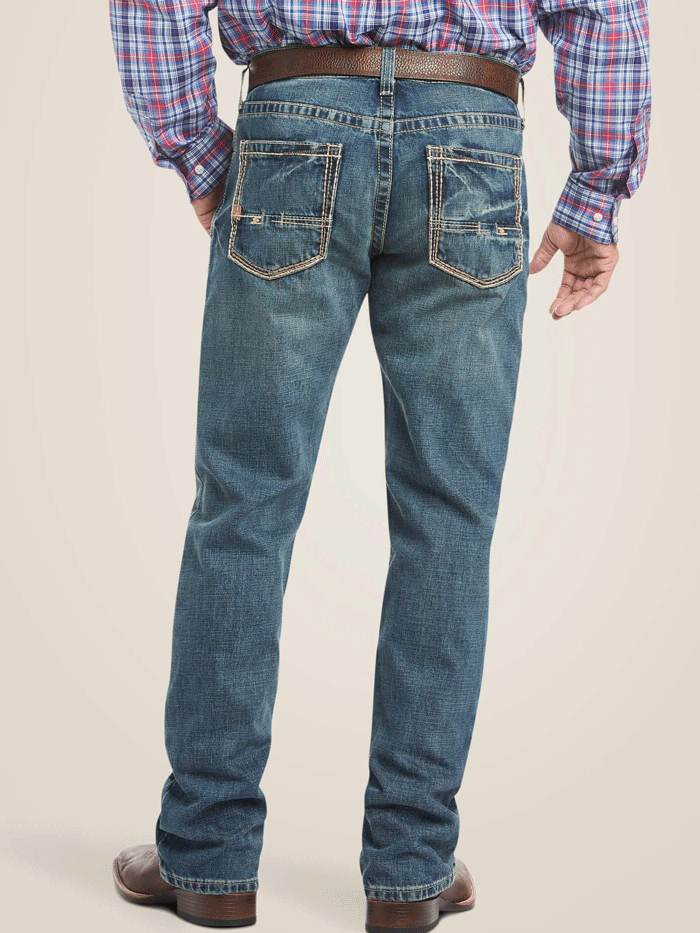 Ariat 10012136 Mens M4 Low Rise Boundary Boot Cut Jean Gulch Denim front view. If you need any assistance with this item or the purchase of this item please call us at five six one seven four eight eight eight zero one Monday through Saturday 10:00a.m EST to 8:00 p.m EST