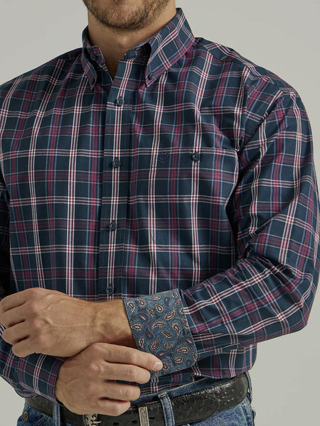 Wrangler 112331817 Mens George Strait Long Sleeve Shirt Navy Fuschia Plaid cuff close up. If you need any assistance with this item or the purchase of this item please call us at five six one seven four eight eight eight zero one Monday through Saturday 10:00a.m EST to 8:00 p.m EST