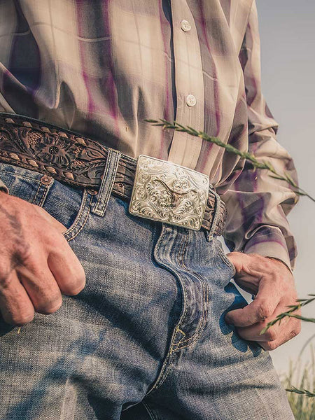 Montana Silversmiths 46510-64 Iconic Western Longhorn Belt Buckle Silver on model. If you need any assistance with this item or the purchase of this item please call us at five six one seven four eight eight eight zero one Monday through Saturday 10:00a.m EST to 8:00 p.m EST