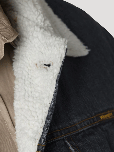 Wrangler 74256RT Mens Western Sherpa Lined Denim Trucker Jacket Rustic close up of sherpa lining. If you need any assistance with this item or the purchase of this item please call us at five six one seven four eight eight eight zero one Monday through Saturday 10:00a.m EST to 8:00 p.m EST