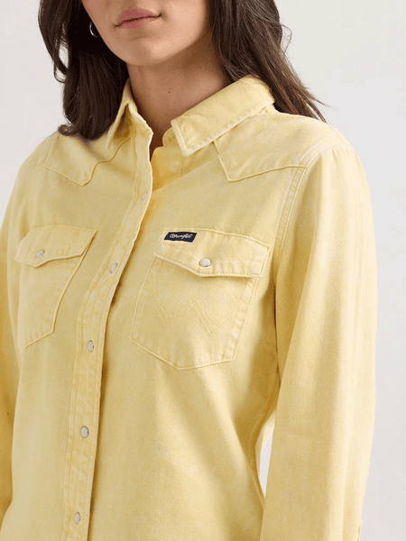Wrangler 112361387 Womens Colorwash Slim Western Snap Shirt Yellow front close up. If you need any assistance with this item or the purchase of this item please call us at five six one seven four eight eight eight zero one Monday through Saturday 10:00a.m EST to 8:00 p.m EST