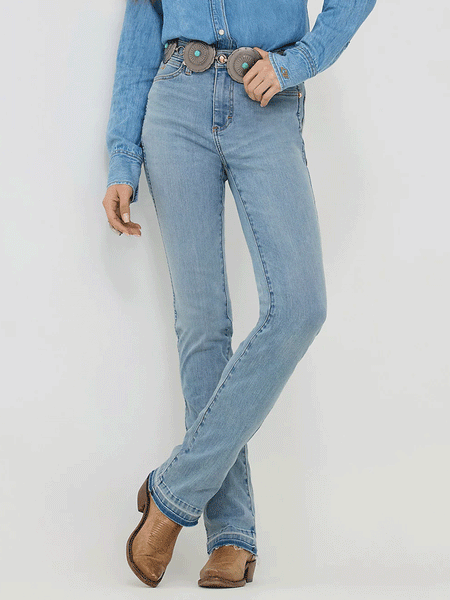 Wrangler 112360639 Womens X Lainey Wilson Raw Hem Boot Hugger Jeans Sky Wash front view. If you need any assistance with this item or the purchase of this item please call us at five six one seven four eight eight eight zero one Monday through Saturday 10:00a.m EST to 8:00 p.m EST