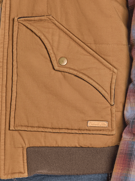Panhandle DM98C06170 Mens Twill and Leather Puffer Lawman Vest Brown pocket close up. If you need any assistance with this item or the purchase of this item please call us at five six one seven four eight eight eight zero one Monday through Saturday 10:00a.m EST to 8:00 p.m EST