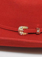Bullhide KINGMAN 4X 0550R Western Felt Hat Red hant band buckle close up. If you need any assistance with this item or the purchase of this item please call us at five six one seven four eight eight eight zero one Monday through Saturday 10:00a.m EST to 8:00 p.m EST
