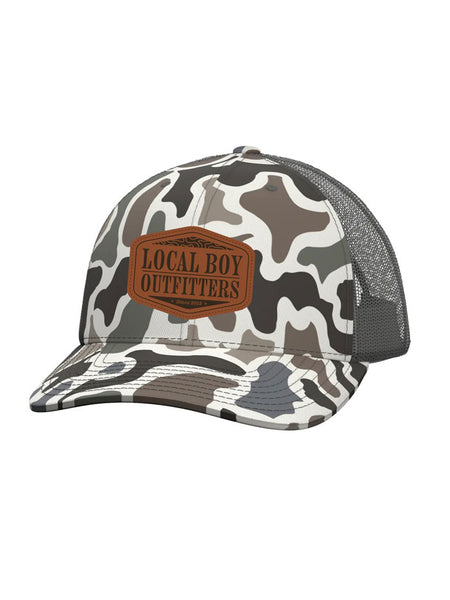 Local Boy Outfitters L3000373-LCF Mens Topo Leather Trucker Hat Localflage front view. If you need any assistance with this item or the purchase of this item please call us at five six one seven four eight eight eight zero one Monday through Saturday 10:00a.m EST to 8:00 p.m EST