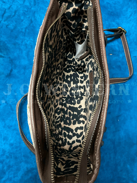 Ariat A770008102 Womens Calf Hair Patchwork Savannah Collection Messenger Bag Brown inside view. If you need any assistance with this item or the purchase of this item please call us at five six one seven four eight eight eight zero one Monday through Saturday 10:00a.m EST to 8:00 p.m EST