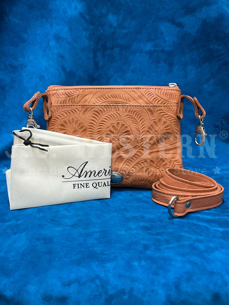 American West 1515884 Ladies Hand Tooled Hip Crossbody Leather Bag Tan front view with protective bag and strap. If you need any assistance with this item or the purchase of this item please call us at five six one seven four eight eight eight zero one Monday through Saturday 10:00a.m EST to 8:00 p.m EST
