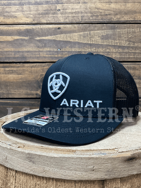 Ariat A300003001 Snapback Shield Logo Cap Black side / front view. If you need any assistance with this item or the purchase of this item please call us at five six one seven four eight eight eight zero one Monday through Saturday 10:00a.m EST to 8:00 p.m EST
