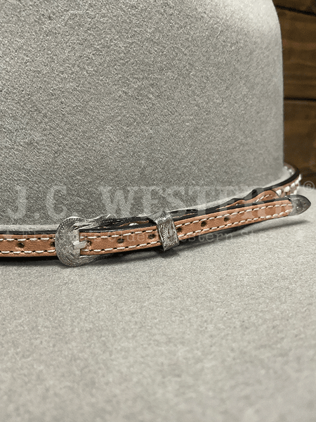 M&F 0201548 Tapered Laced Hat Band Natural buckle view. If you need any assistance with this item or the purchase of this item please call us at five six one seven four eight eight eight zero one Monday through Saturday 10:00a.m EST to 8:00 p.m EST