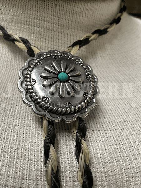 Cowboy Collectibles BOLT512 Turquoise Sunflower Bolo Tie Black And Grey close up. If you need any assistance with this item or the purchase of this item please call us at five six one seven four eight eight eight zero one Monday through Saturday 10:00a.m EST to 8:00 p.m EST