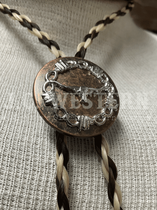 Cowboy Collectibles BOLT506 The Longhorn Bolo Tie Creme And Dark Sorrel close up. If you need any assistance with this item or the purchase of this item please call us at five six one seven four eight eight eight zero one Monday through Saturday 10:00a.m EST to 8:00 p.m EST