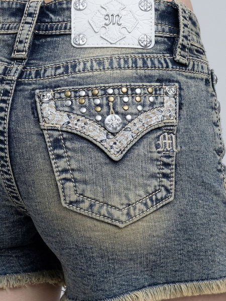 Miss Me M9620H Womens Savannah Studded Shorts Vintage Blue close up. If you need any assistance with this item or the purchase of this item please call us at five six one seven four eight eight eight zero one Monday through Saturday 10:00a.m EST to 8:00 p.m EST