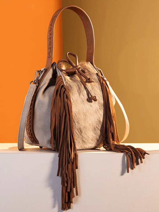 Montana West MWF1046-205STN Womens Hair On Drawstring Hobo/Crossbody Bag Tan side view. If you need any assistance with this item or the purchase of this item please call us at five six one seven four eight eight eight zero one Monday through Saturday 10:00a.m EST to 8:00 p.m EST
