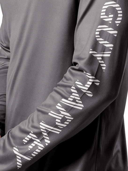 Guy Harvey GHV56925-GRY Mens Rack UPF 50 Sun Protection Hoodie Grey sleeve view. If you need any assistance with this item or the purchase of this item please call us at five six one seven four eight eight eight zero one Monday through Saturday 10:00a.m EST to 8:00 p.m EST