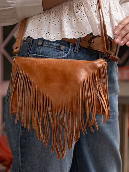 Bed Stu A694264-TADD-X Womens Silverrock Crossbody Handbag Tan front view on model. If you need any assistance with this item or the purchase of this item please call us at five six one seven four eight eight eight zero one Monday through Saturday 10:00a.m EST to 8:00 p.m EST