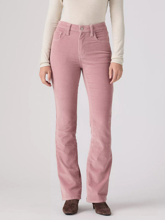 A model wearing a pair of dusty rose pink corduroy pants, styled with a cream long-sleeve top and brown suede boots, photographed against a light gray studio background. If you need any assistance with this item or the purchase of this item please call us at five six one seven four eight eight eight zero one Monday through Saturday 10:00a.m EST to 8:00 p.m EST