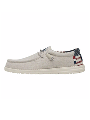 Hey Dude 40001-1K1 Mens Wally Patriotic Shoe Off White side view. If you need any assistance with this item or the purchase of this item please call us at five six one seven four eight eight eight zero one Monday through Saturday 10:00a.m EST to 8:00 p.m EST