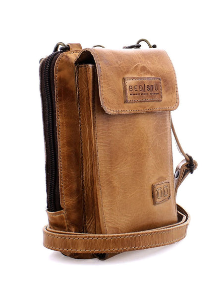 Bed Stu A450319-TNRS-X Womens Alelike Essentials Crossbody Bag Tan Rustic front and side view. If you need any assistance with this item or the purchase of this item please call us at five six one seven four eight eight eight zero one Monday through Saturday 10:00a.m EST to 8:00 p.m EST