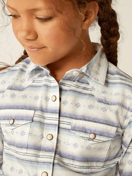 Ariat 10055292 Kids Alyssa Shirt Geo Stream Serape Light Blue front close up view. If you need any assistance with this item or the purchase of this item please call us at five six one seven four eight eight eight zero one Monday through Saturday 10:00a.m EST to 8:00 p.m EST