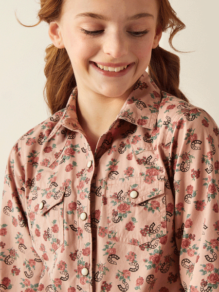 Ariat 10053889 Kids Flowers n Horseshoes Print Shirt front close up. If you need any assistance with this item or the purchase of this item please call us at five six one seven four eight eight eight zero one Monday through Saturday 10:00a.m EST to 8:00 p.m EST