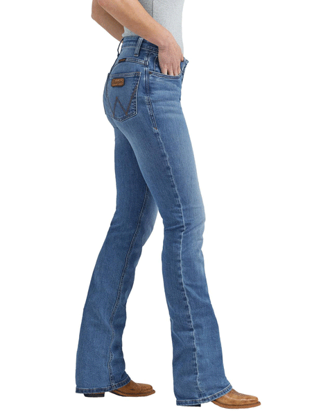 Wrangler 112352987 Womens Willow Mid Rise Bootcut Jean Sophia side view. If you need any assistance with this item or the purchase of this item please call us at five six one seven four eight eight eight zero one Monday through Saturday 10:00a.m EST to 8:00 p.m EST