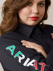 Ariat 10043552 Womens Mexico Wrinkle Resist Team Kirby Stretch Shirt Black close up of ariat embroidery on arm. If you need any assistance with this item or the purchase of this item please call us at five six one seven four eight eight eight zero one Monday through Saturday 10:00a.m EST to 8:00 p.m EST