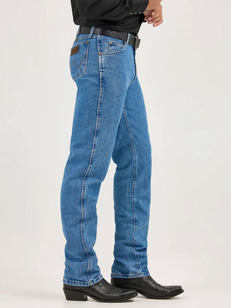 Wrangler 47MWZSW Mens Premium Performance Cowboy Cut Regular Fit Jean Stonewash side view. If you need any assistance with this item or the purchase of this item please call us at five six one seven four eight eight eight zero one Monday through Saturday 10:00a.m EST to 8:00 p.m EST