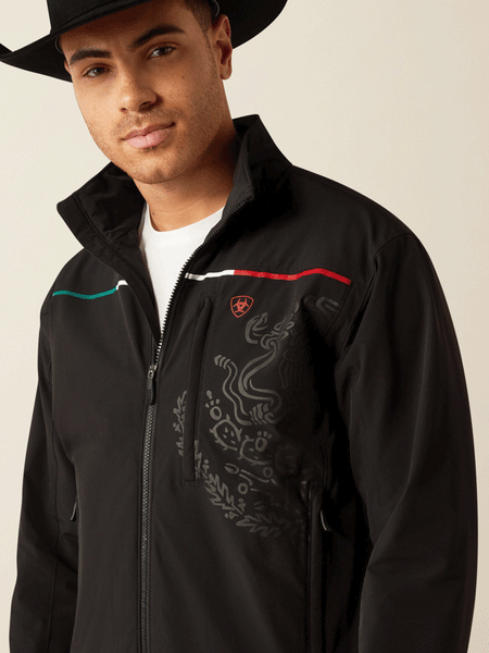 Ariat 10054234 Mens Pioneer StretchShell Mexico Jacket Black front close up. If you need any assistance with this item or the purchase of this item please call us at five six one seven four eight eight eight zero one Monday through Saturday 10:00a.m EST to 8:00 p.m EST