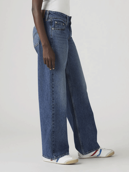 Levi's A74980008 Womens Superlow Loose Jeans Blended Beauty Blue side view. If you need any assistance with this item or the purchase of this item please call us at five six one seven four eight eight eight zero one Monday through Saturday 10:00a.m EST to 8:00 p.m EST