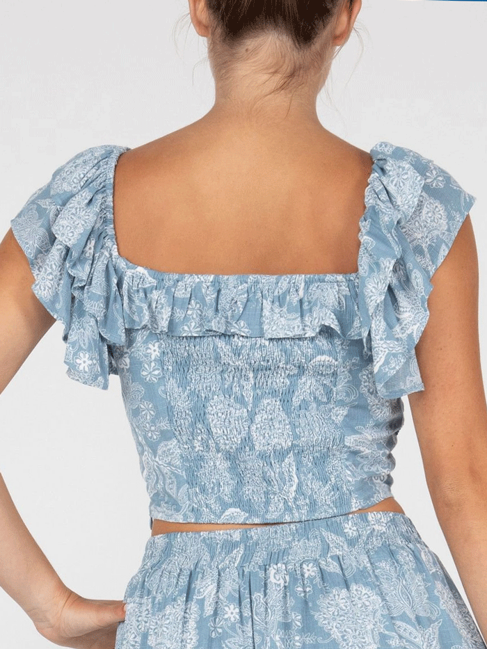 Miss Me MT2877S Womens Cropped Ruffled Floral Top Light Blue front view. If you need any assistance with this item or the purchase of this item please call us at five six one seven four eight eight eight zero one Monday through Saturday 10:00a.m EST to 8:00 p.m EST