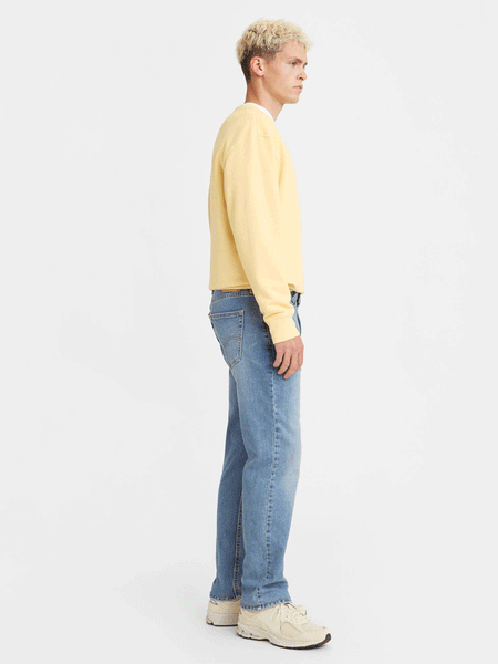 Levi's 005141593 Mens Straight Fit Flex Jeans Everyday Indigo Medium Wash side view. If you need any assistance with this item or the purchase of this item please call us at five six one seven four eight eight eight zero one Monday through Saturday 10:00a.m EST to 8:00 p.m EST