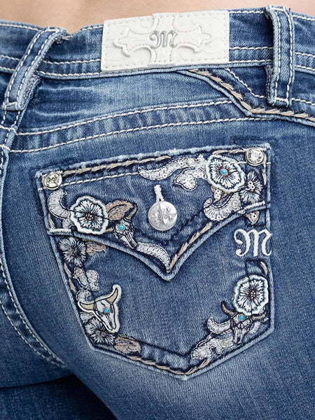Miss Me M9681B Womens Mid Rise Bootcut Jeans Medium Blue back close up. If you need any assistance with this item or the purchase of this item please call us at five six one seven four eight eight eight zero one Monday through Saturday 10:00a.m EST to 8:00 p.m EST