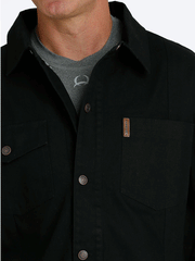 Cinch MWJ1598001 Mens Canvas Ranch Coat Black front close up view. If you need any assistance with this item or the purchase of this item please call us at five six one seven four eight eight eight zero one Monday through Saturday 10:00a.m EST to 8:00 p.m EST