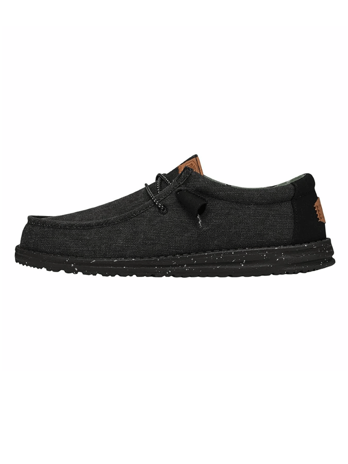 Hey Dude 40296-060 Mens Wally Washed Canvas Shoe Black front and side view. If you need any assistance with this item or the purchase of this item please call us at five six one seven four eight eight eight zero one Monday through Saturday 10:00a.m EST to 8:00 p.m EST