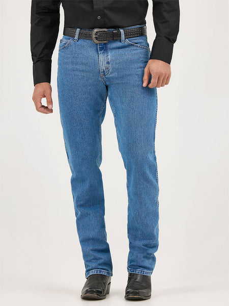 Wrangler 47MWZSW Mens Premium Performance Cowboy Cut Regular Fit Jean Stonewash front view. If you need any assistance with this item or the purchase of this item please call us at five six one seven four eight eight eight zero one Monday through Saturday 10:00a.m EST to 8:00 p.m EST