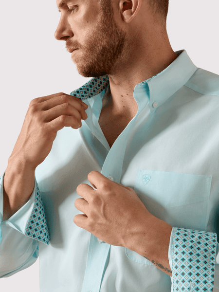 Ariat 10071537 Mens Wrinkle Free Solid Pinpoint Oxford Classic Fit Shirt Angel Blue front close up view. If you need any assistance with this item or the purchase of this item please call us at five six one seven four eight eight eight zero one Monday through Saturday 10:00a.m EST to 8:00 p.m EST