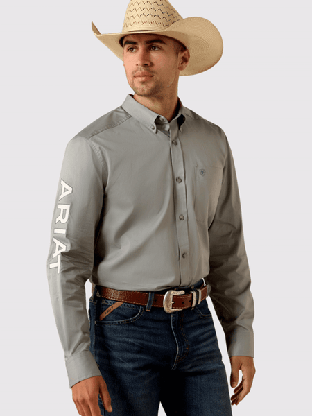 Ariat 10071690 Mens Team Logo Lightweight Twill Fitted Shirt Grey front and side view. If you need any assistance with this item or the purchase of this item please call us at five six one seven four eight eight eight zero one Monday through Saturday 10:00a.m EST to 8:00 p.m EST