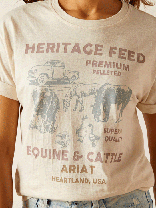 Ariat 10051291 Womens Feed T-Shirt Oatmeal Heather close up graphic view. If you need any assistance with this item or the purchase of this item please call us at five six one seven four eight eight eight zero one Monday through Saturday 10:00a.m EST to 8:00 p.m EST