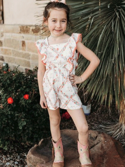 Shea Baby JUP06 Kids Floral Boot Romper White on model. If you need any assistance with this item or the purchase of this item please call us at five six one seven four eight eight eight zero one Monday through Saturday 10:00a.m EST to 8:00 p.m EST