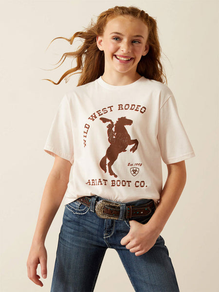 Ariat 10058863 Kids Wild West Rodeo T-Shirt Pink Tint front view. If you need any assistance with this item or the purchase of this item please call us at five six one seven four eight eight eight zero one Monday through Saturday 10:00a.m EST to 8:00 p.m EST